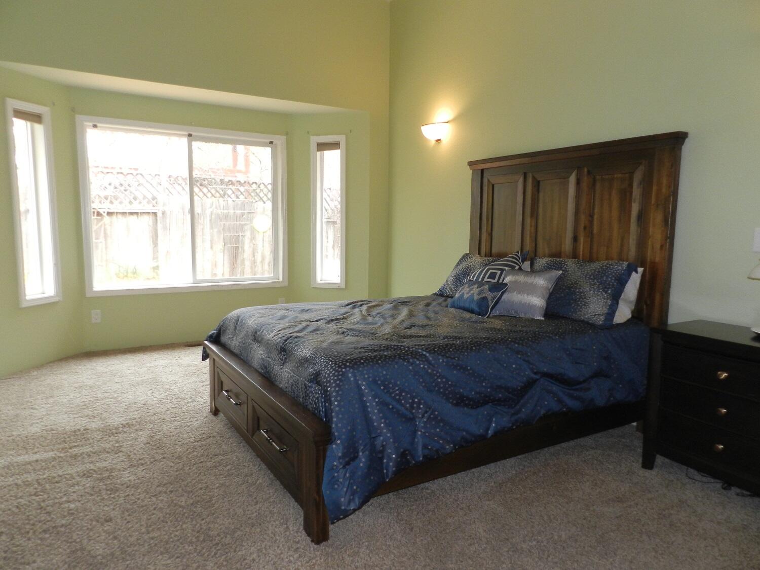 648 Benjamin Way Phoenix, OR 97535 - Photo 15 of 29 a bedroom with a bed and a window