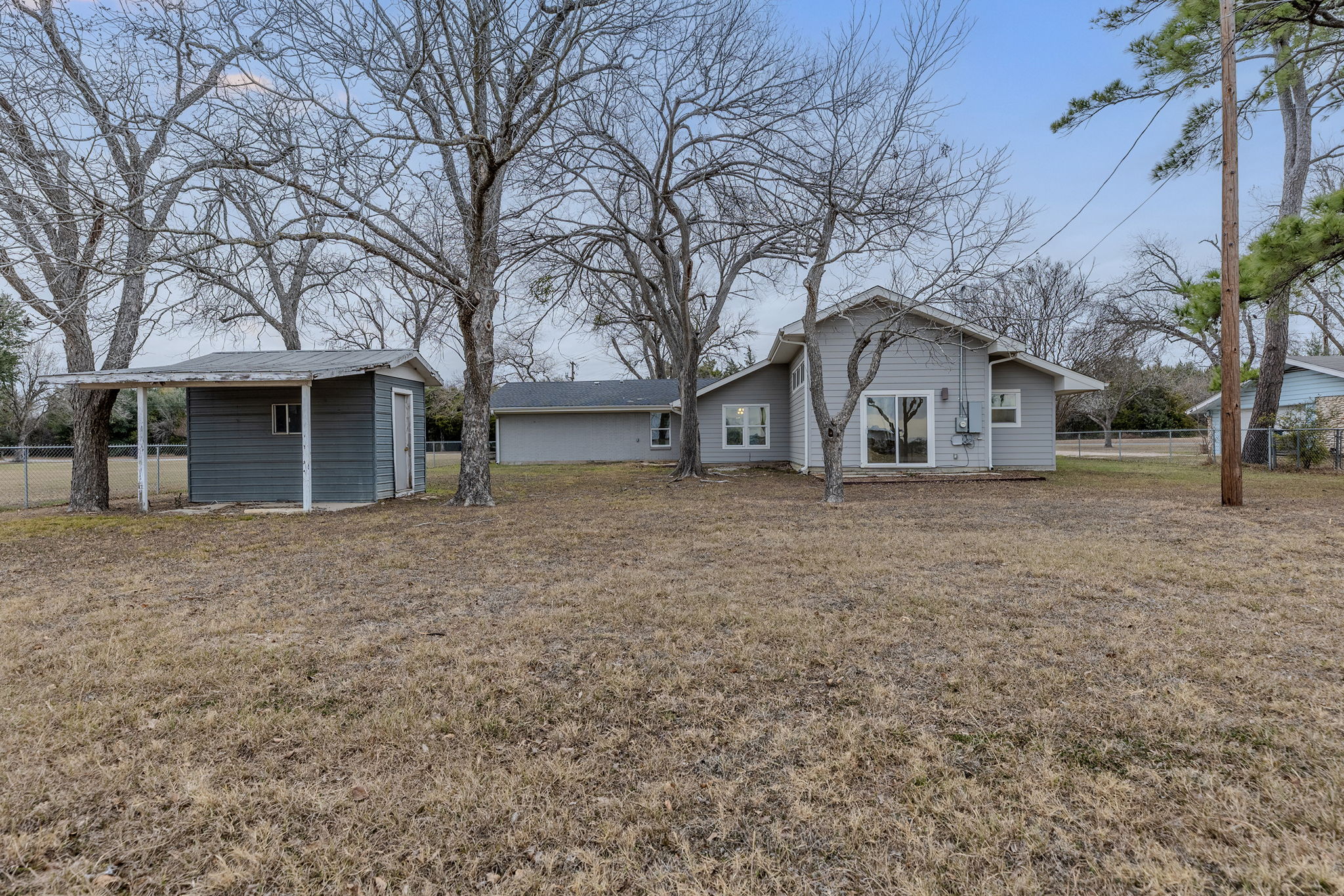 813 Central Avenue Elgin, TX 78621 - Photo 5 of 22 Rear view of property with an outdoor structure