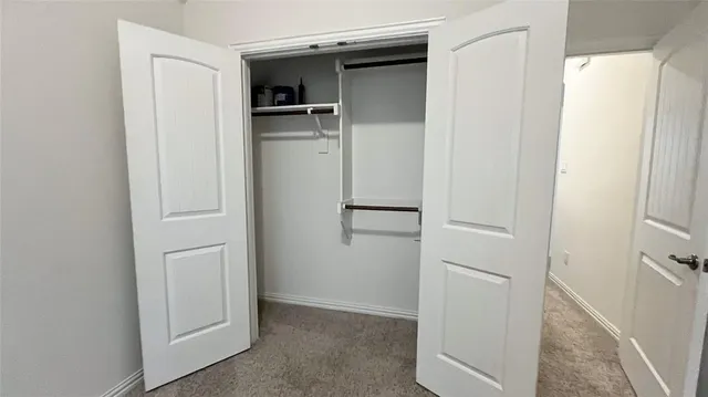 a view of an empty walk in closet