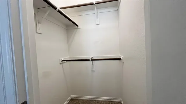 a view of a hallway with closet