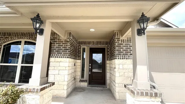 a view of an entryway with a front door