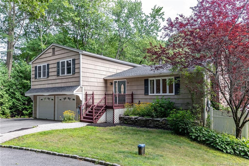 93 Blueberry Hill Road Bridgewater, CT 06752 - Photo 1 of 1 a front view of a house with a garden