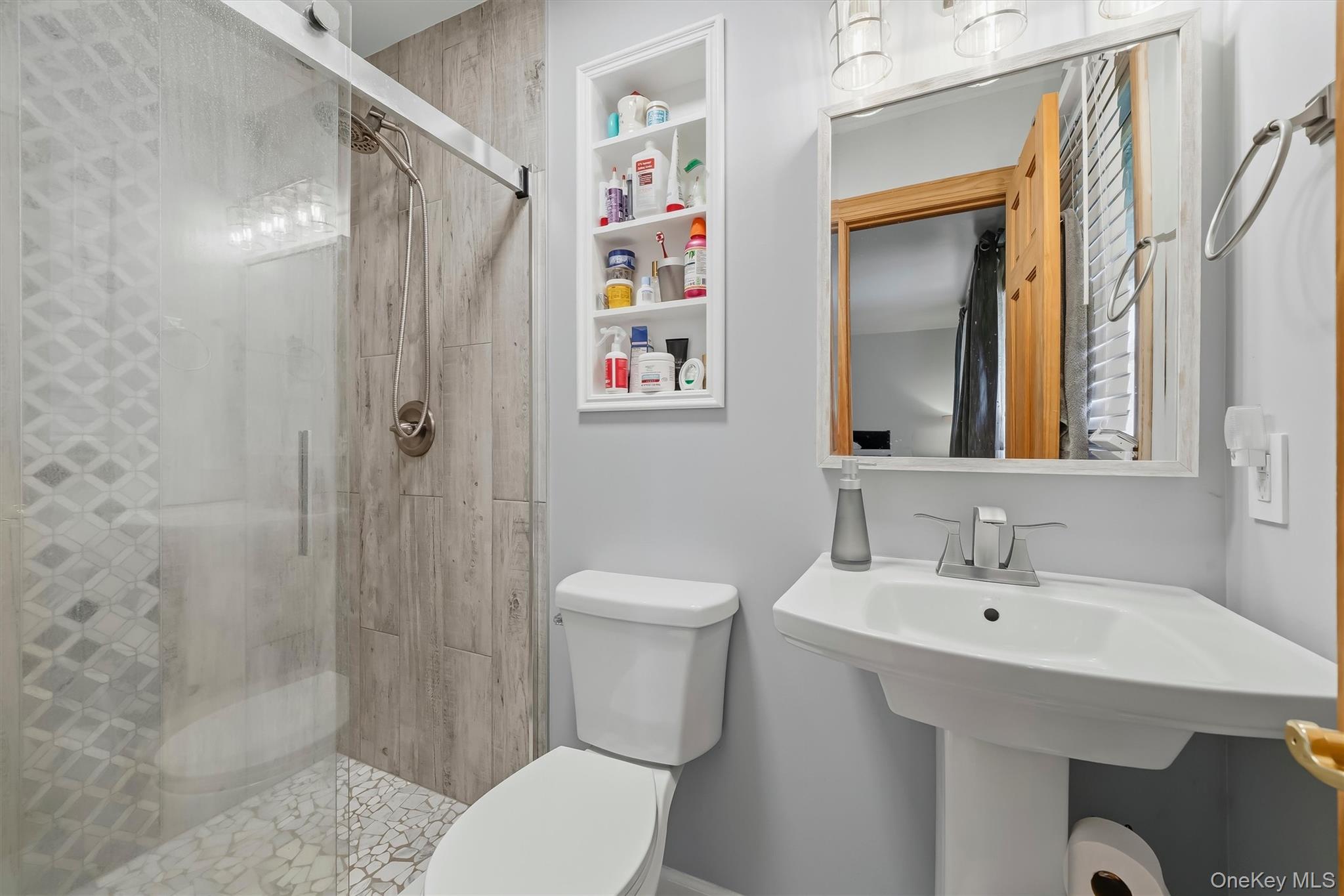 318 Beattie Road Washingtonville, NY 10992 - Photo 18 of 42 a bathroom with a sink toilet and shower