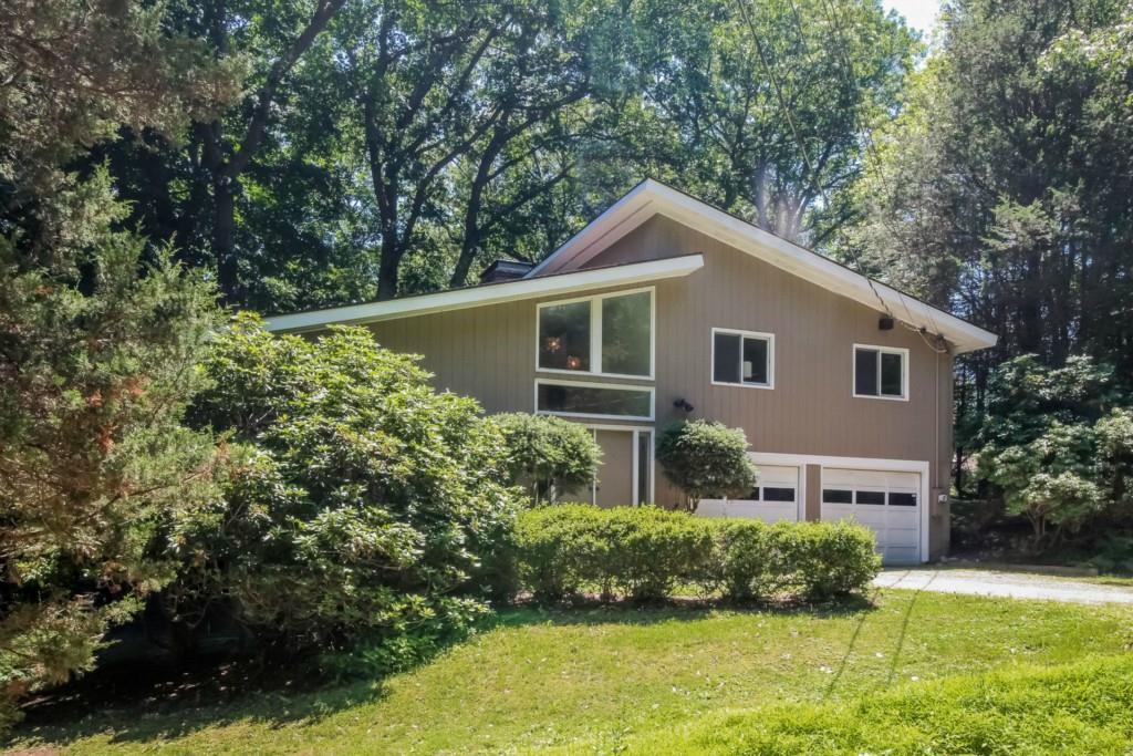 175 Ford Road Woodbridge, CT 06525 - Photo 1 of 1 a front view of a house with a yard