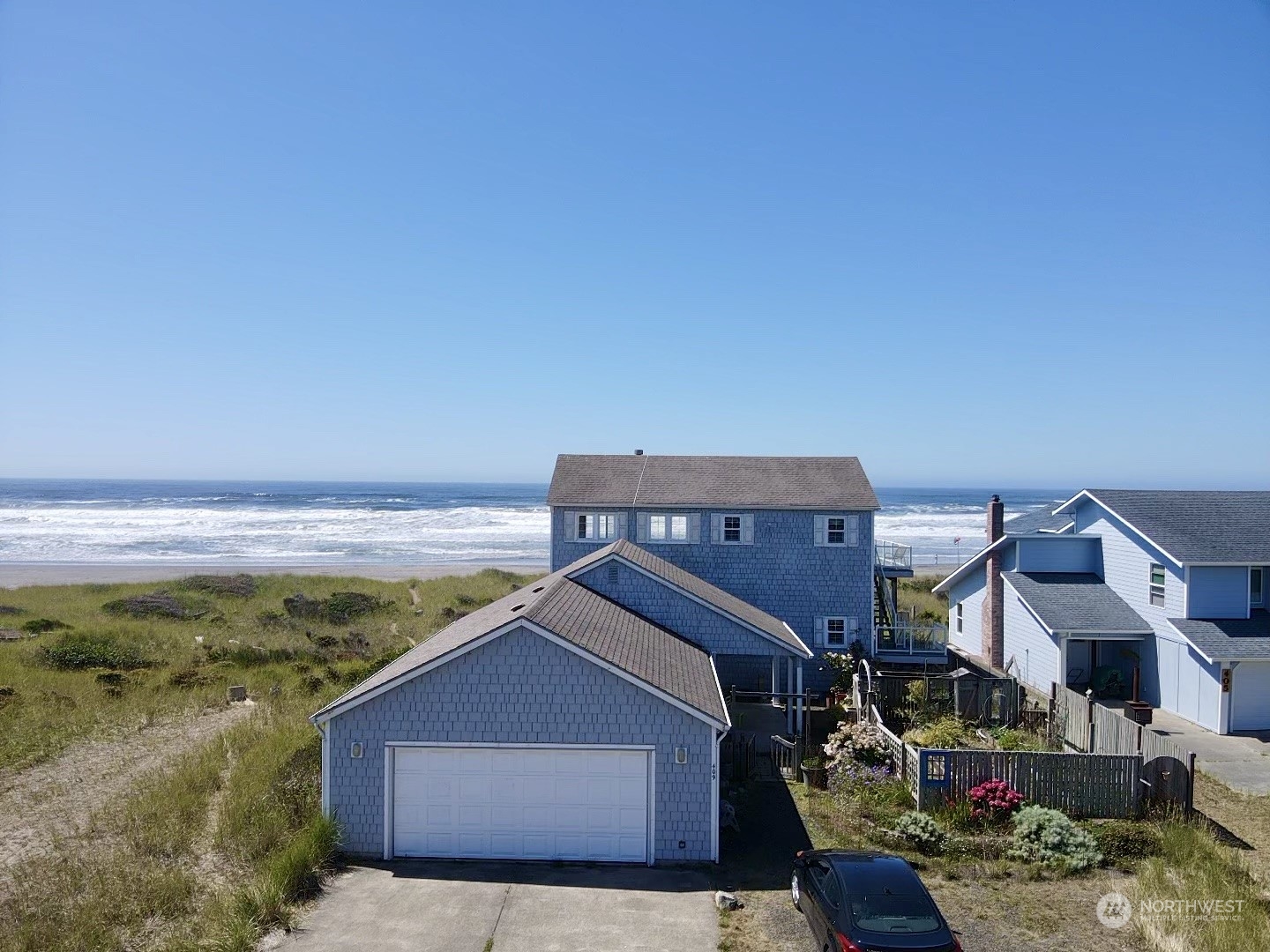 a view of a house with a ocean view