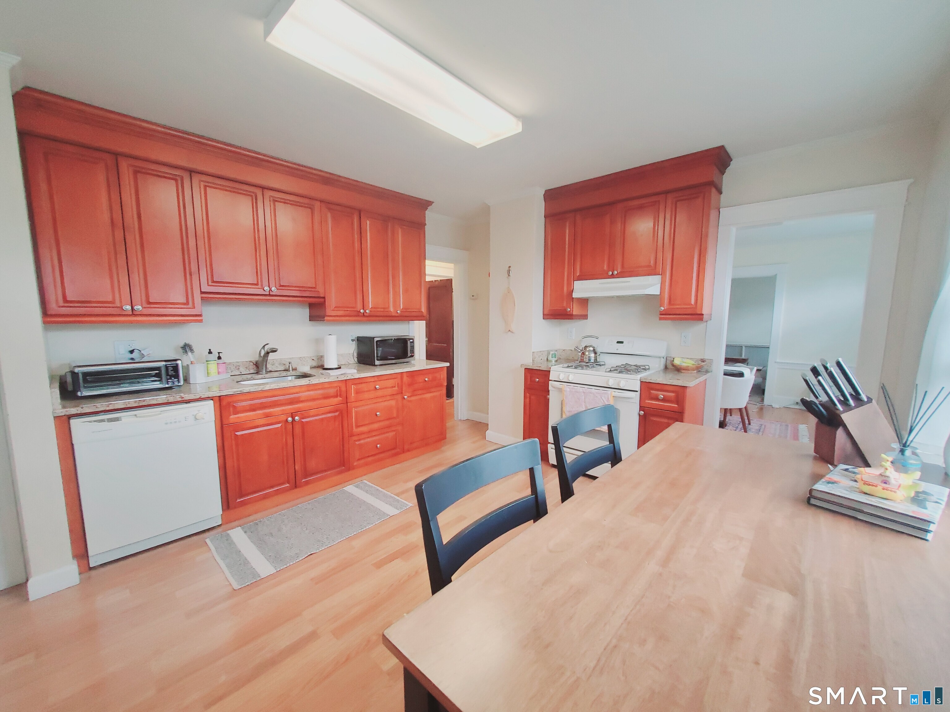 a kitchen with a sink cabinets and window