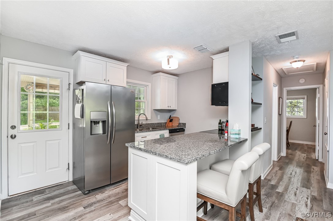 184 Fox Road Gum Spring, VA 23065 - Photo 12 of 27 a kitchen with granite countertop a refrigerator and a sink