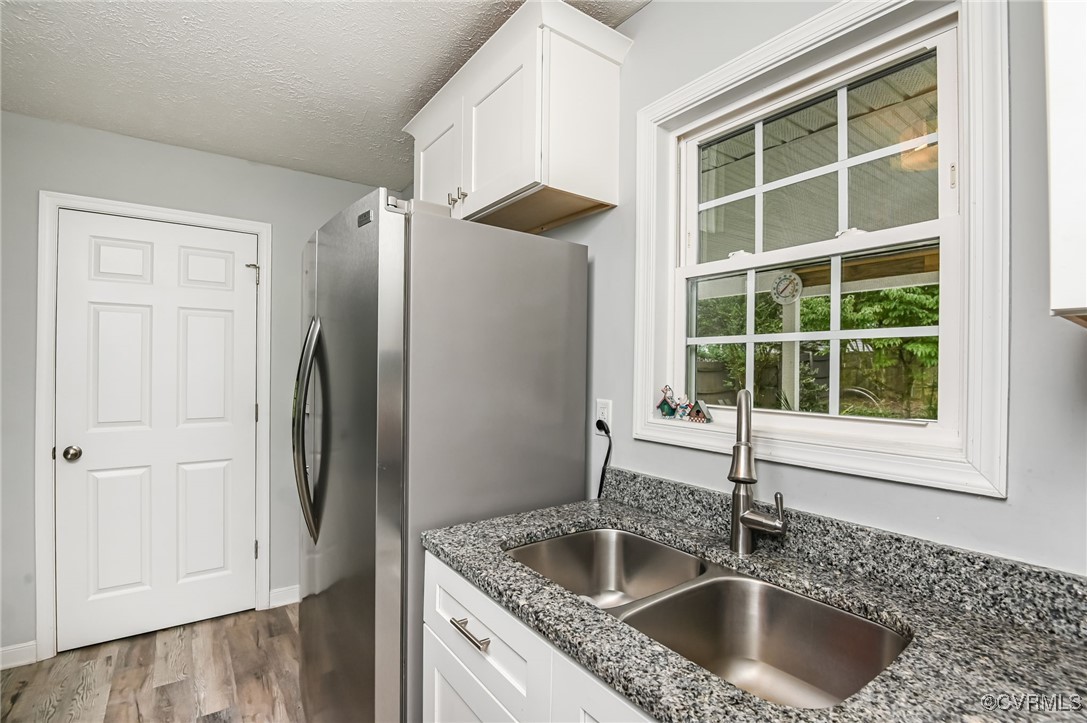184 Fox Road Gum Spring, VA 23065 - Photo 14 of 27 a kitchen with stainless steel appliances granite countertop a sink and a refrigerator