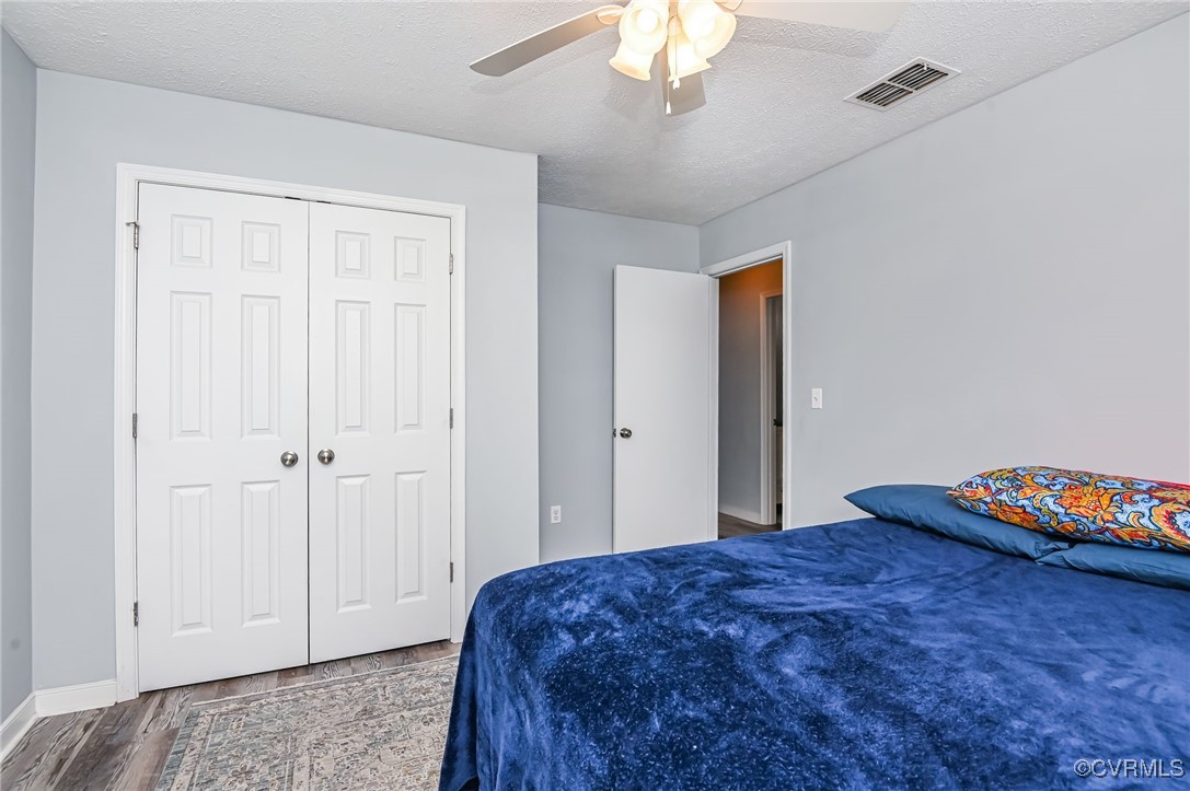 184 Fox Road Gum Spring, VA 23065 - Photo 16 of 27 a bedroom with a bed and a chandelier