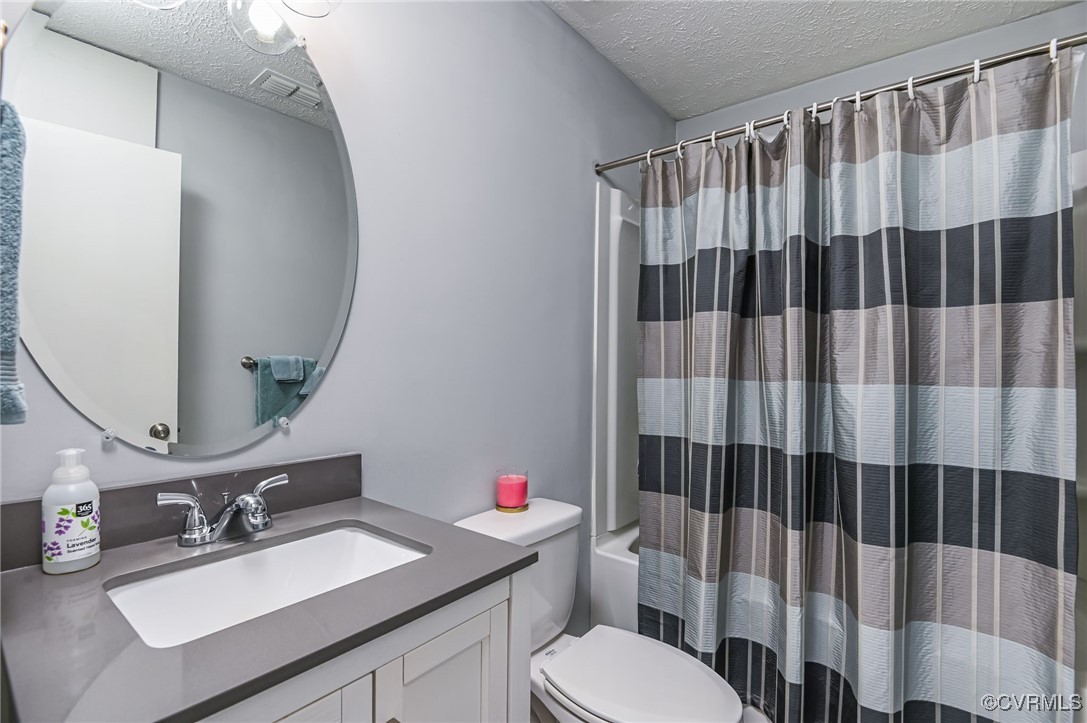 184 Fox Road Gum Spring, VA 23065 - Photo 17 of 27 a bathroom with a sink vanity mirror and toilet