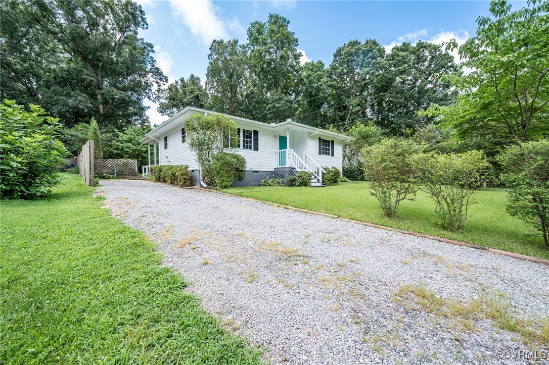 184 Fox Road Gum Spring, VA 23065 - Photo 2 of 27 a front view of a house with a yard and trees