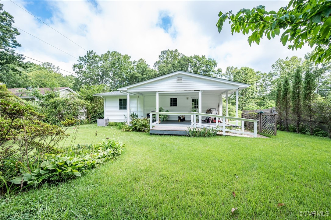 184 Fox Road Gum Spring, VA 23065 - Photo 23 of 27 a patio with a table and chairs under an umbrella