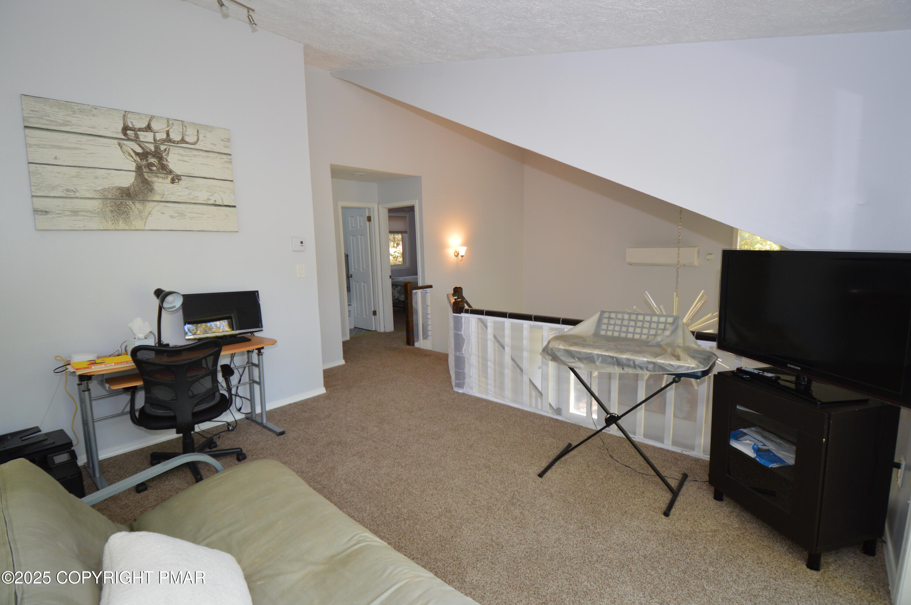 128 Ashley Court Bushkill, PA 18324 - Photo 31 of 43 a living room with furniture and a flat screen tv