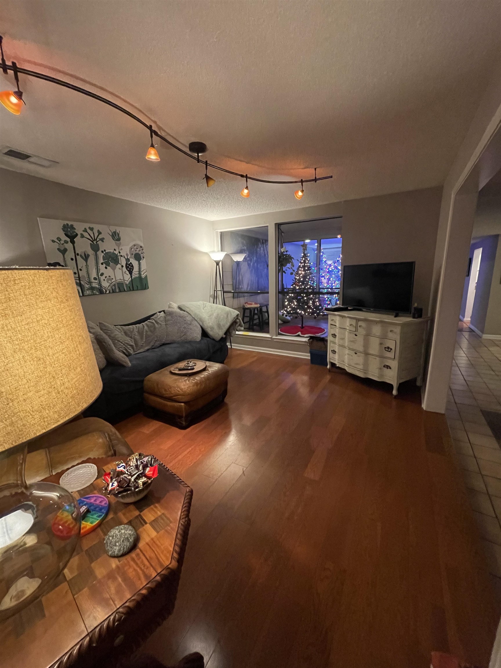 8469 Rothchild Road, Unit 33 Germantown, TN 38139 - Photo 12 of 25 Living room with hardwood / wood-style floors, a textured ceiling, and track lighting