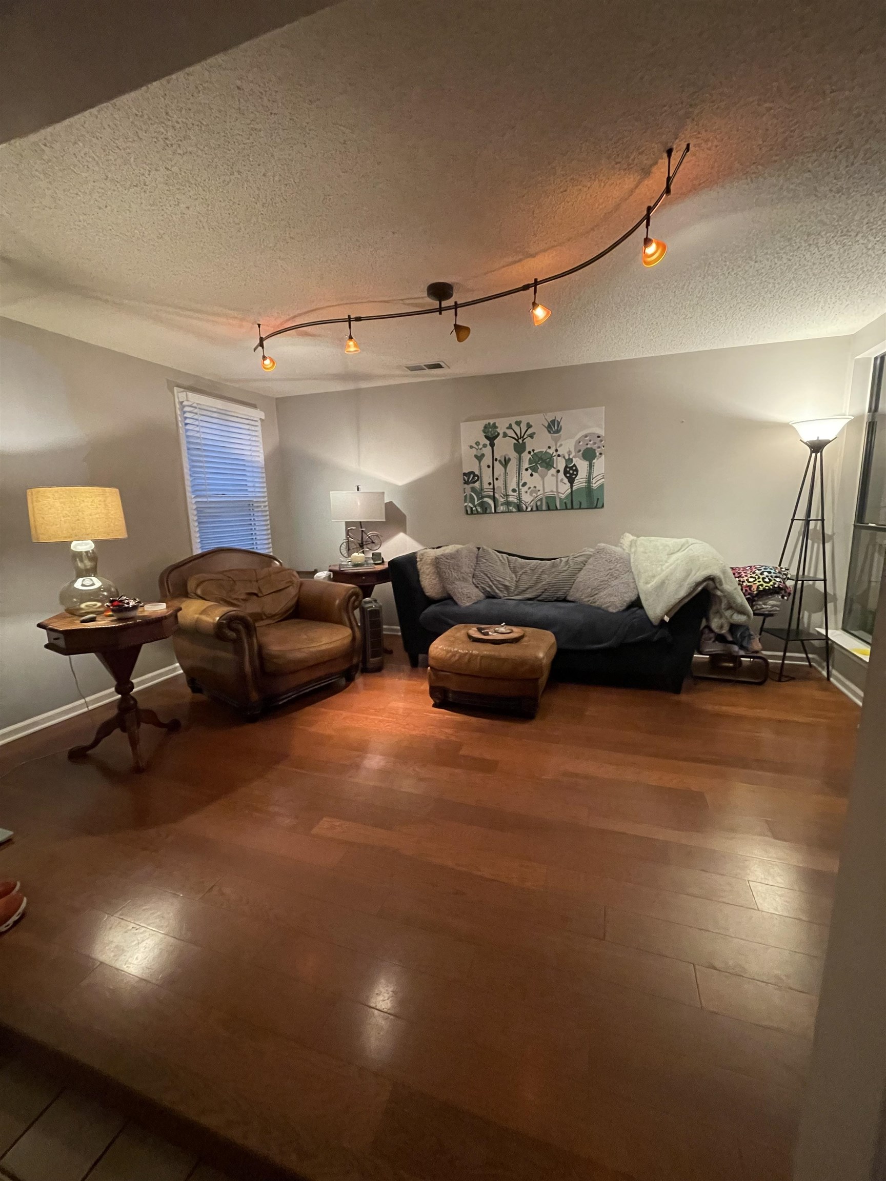 8469 Rothchild Road, Unit 33 Germantown, TN 38139 - Photo 13 of 25 Interior space featuring rail lighting, a textured ceiling, and hardwood / wood-style flooring