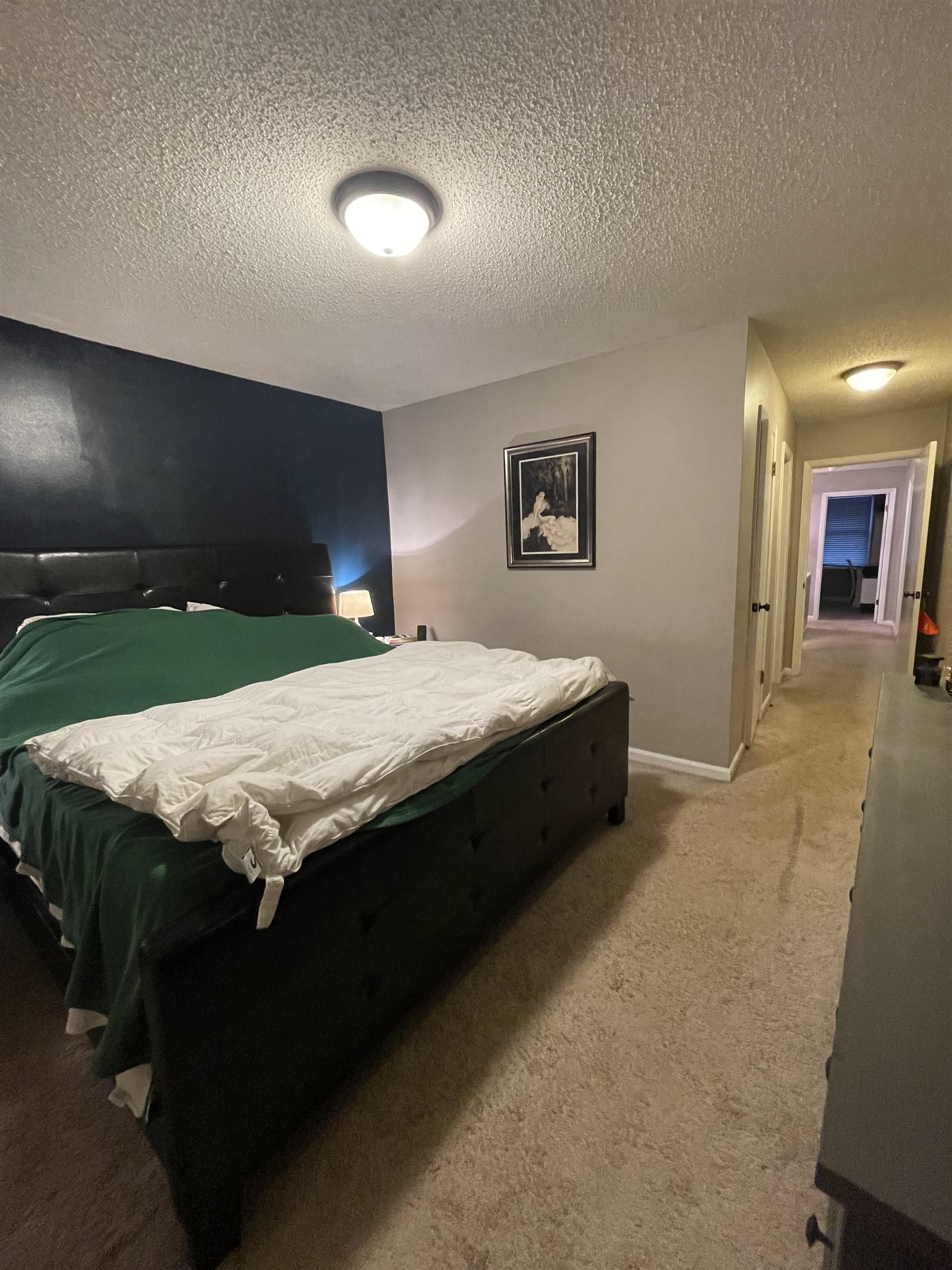 8469 Rothchild Road, Unit 33 Germantown, TN 38139 - Photo 19 of 25 Carpeted bedroom featuring a textured ceiling