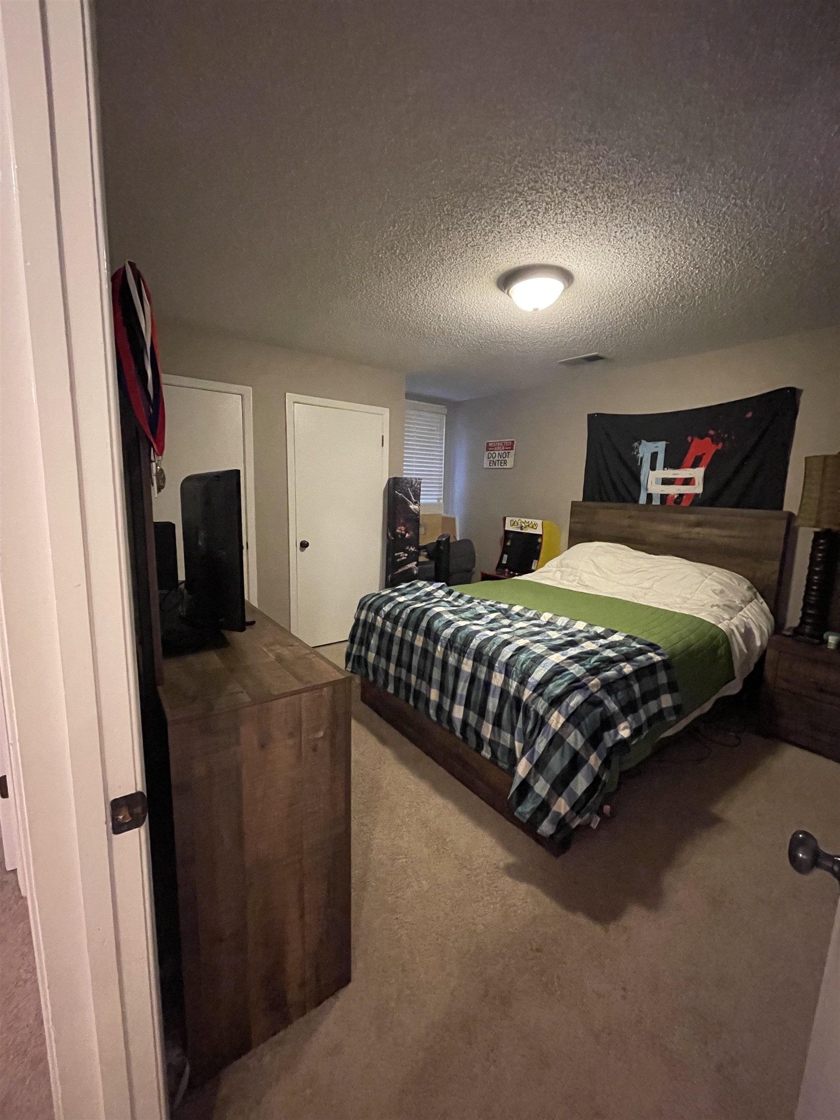 8469 Rothchild Road, Unit 33 Germantown, TN 38139 - Photo 22 of 25 Carpeted bedroom featuring a textured ceiling