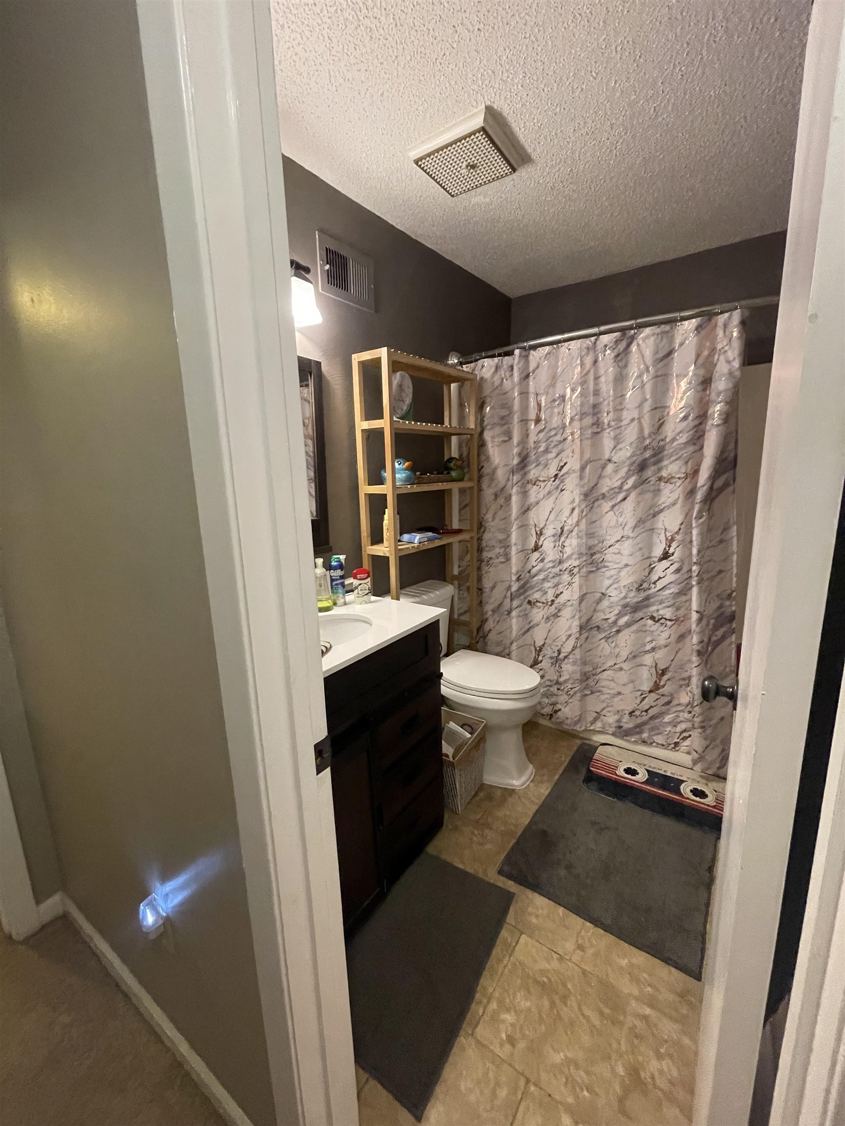 8469 Rothchild Road, Unit 33 Germantown, TN 38139 - Photo 23 of 25 Bathroom featuring vanity, toilet, a textured ceiling, and walk in shower