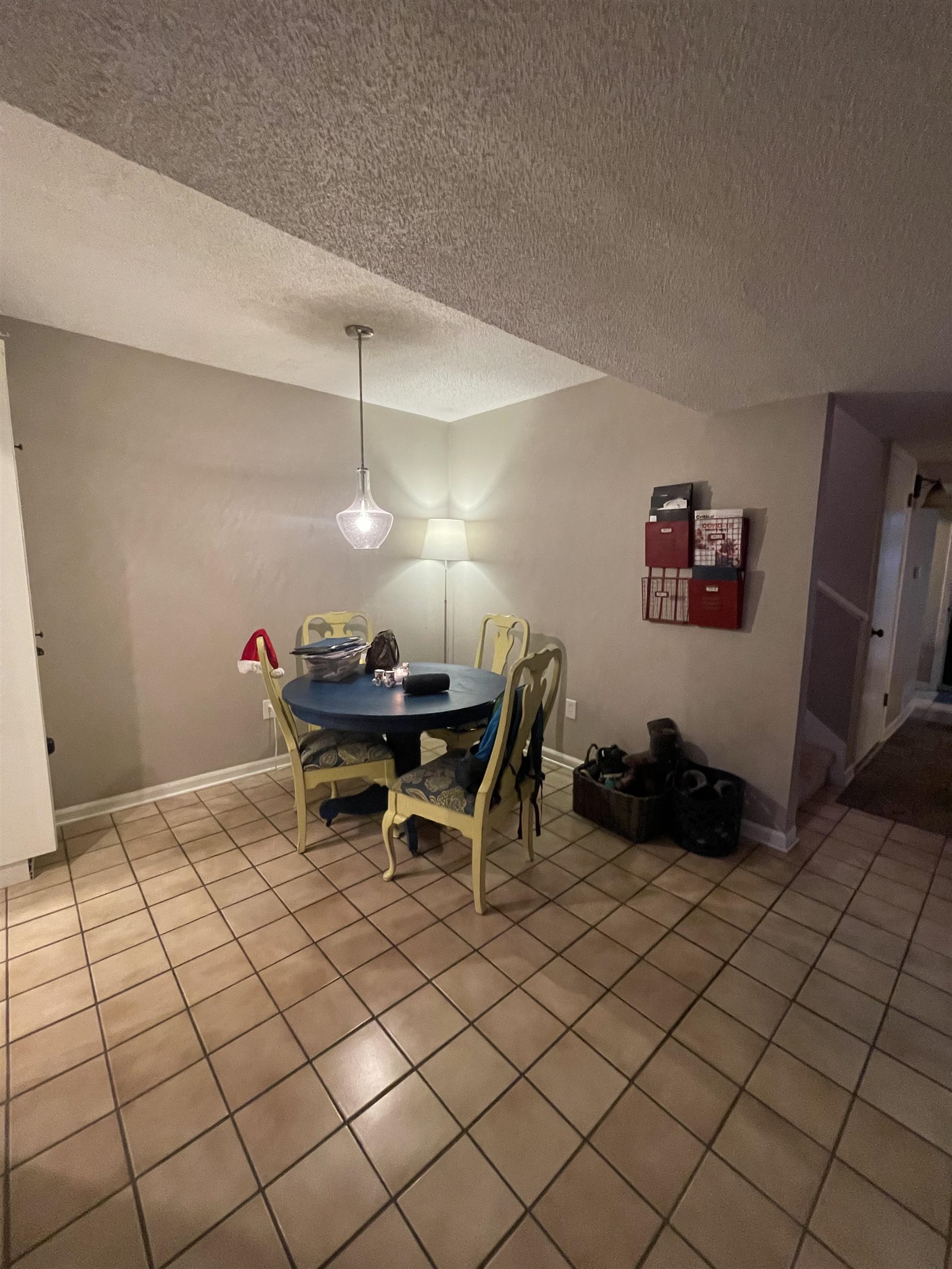 8469 Rothchild Road, Unit 33 Germantown, TN 38139 - Photo 9 of 25 Tiled dining area with a textured ceiling