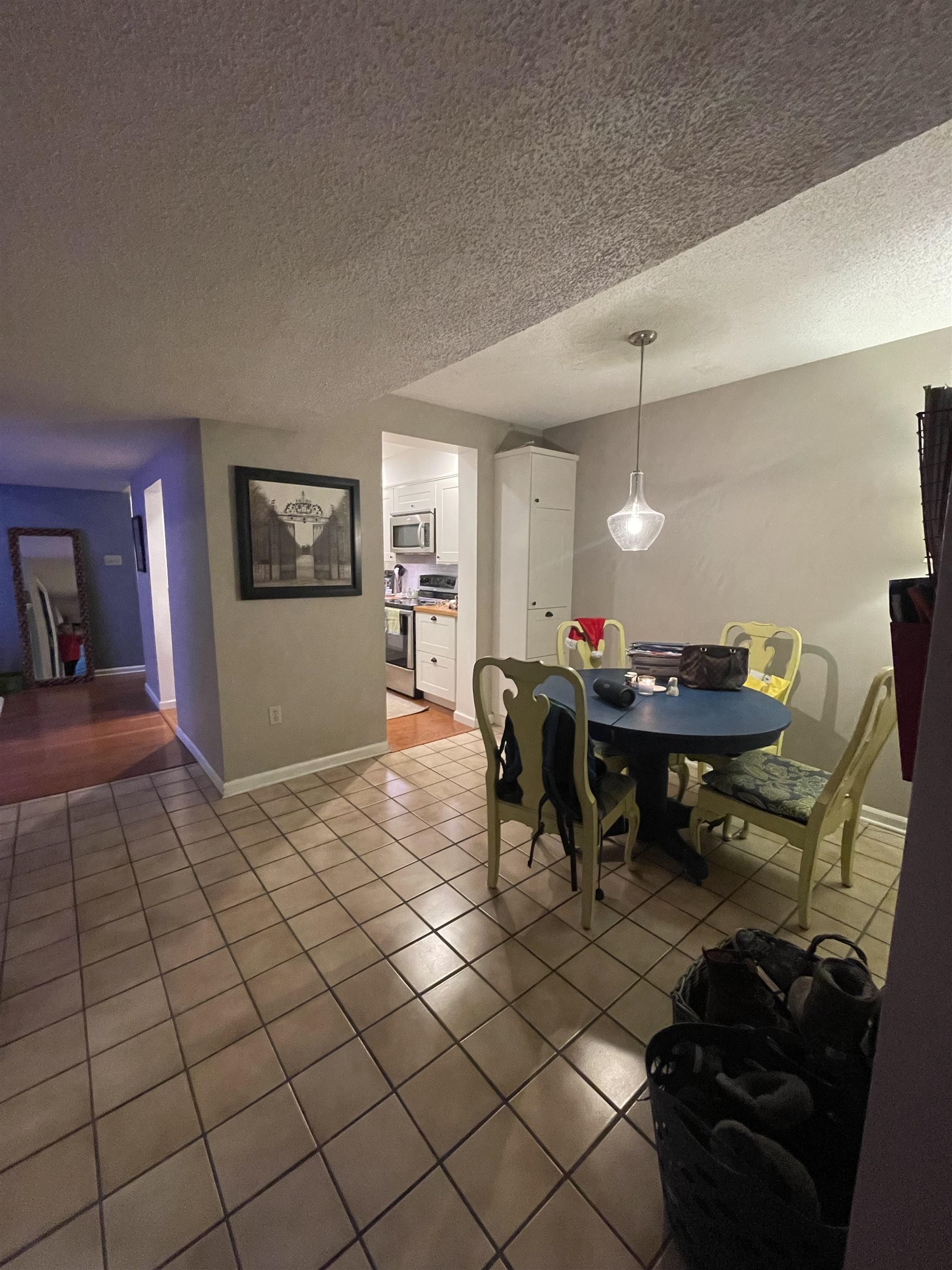 8469 Rothchild Road, Unit 33 Germantown, TN 38139 - Photo 10 of 25 Dining space with tile patterned flooring and a textured ceiling
