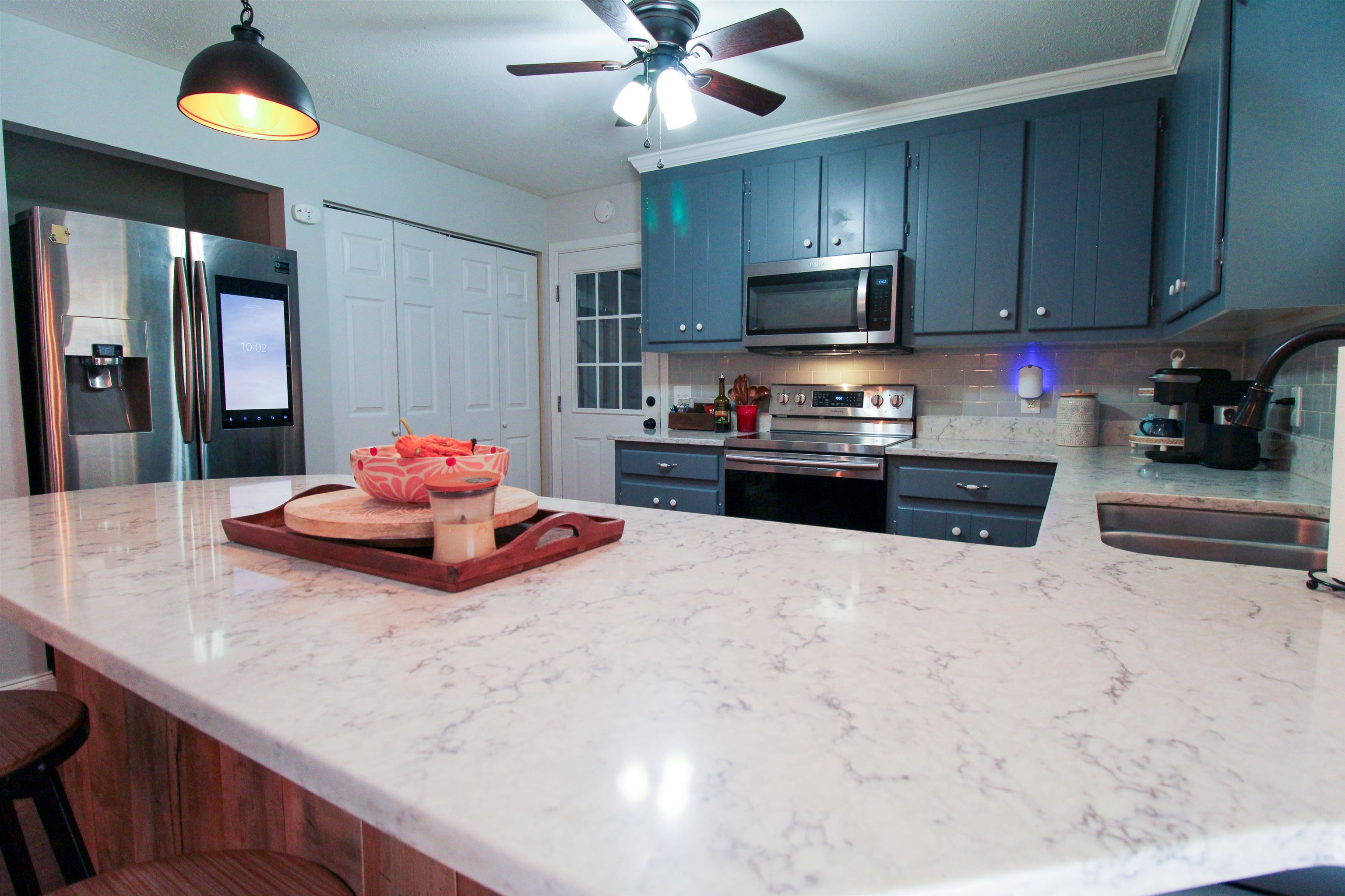 169 Calf Mountain Road Waynesboro, VA 22980 - Photo 17 of 74 a kitchen with granite countertop a sink stainless steel appliances and cabinets