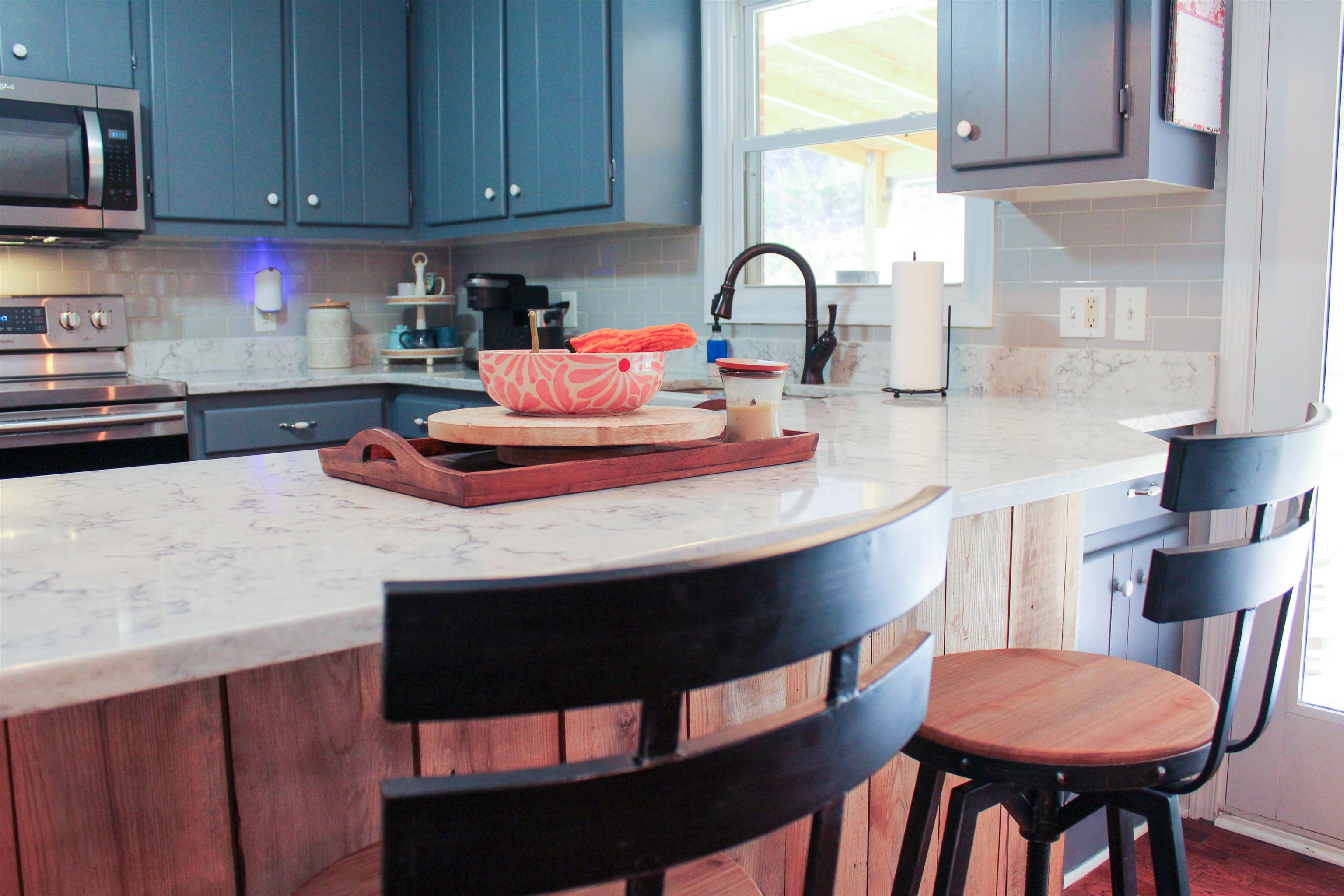 169 Calf Mountain Road Waynesboro, VA 22980 - Photo 24 of 74 a kitchen with stainless steel appliances a sink a table and chairs