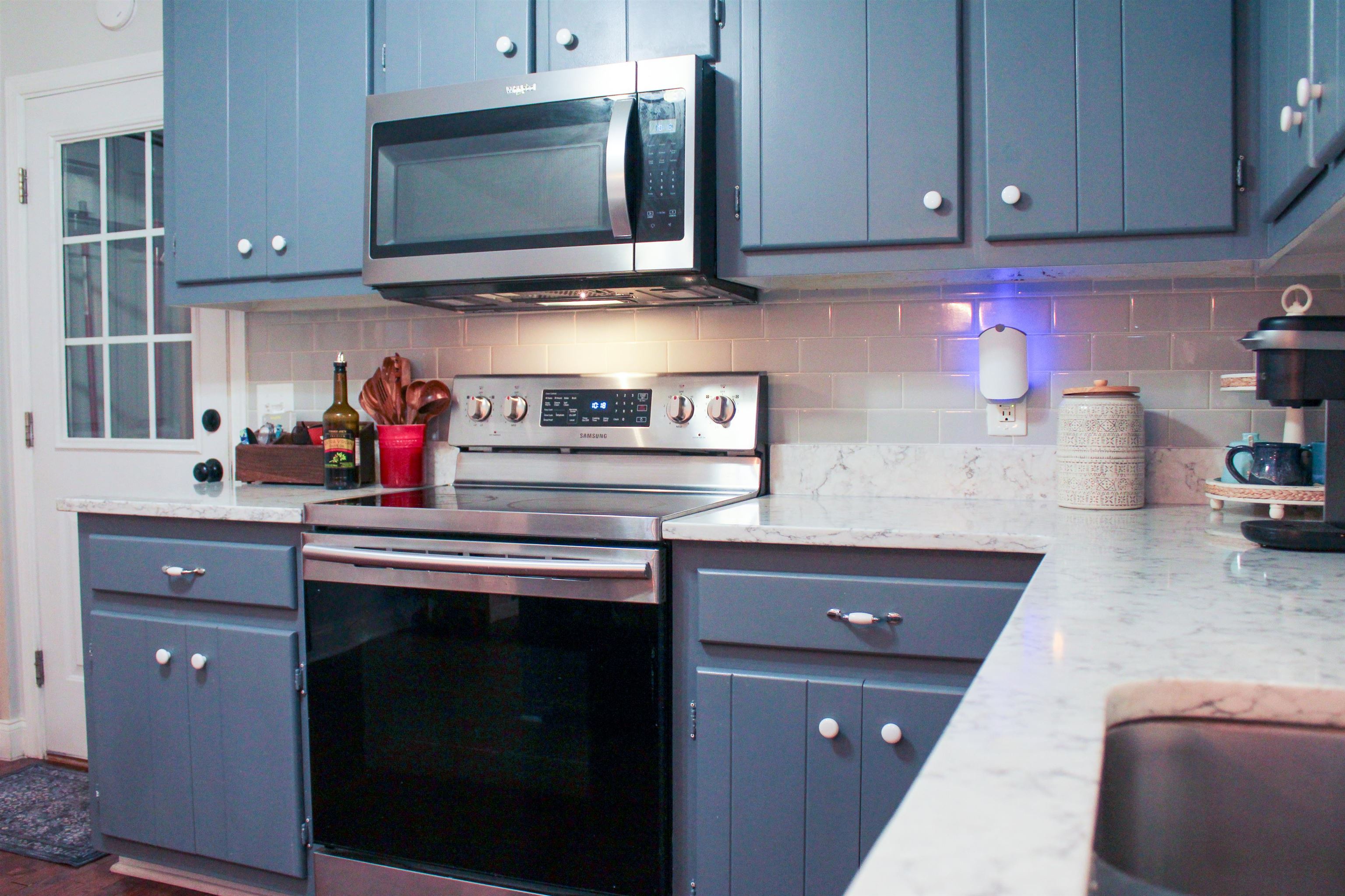 169 Calf Mountain Road Waynesboro, VA 22980 - Photo 26 of 74 a kitchen with stainless steel appliances granite countertop a sink and cabinets