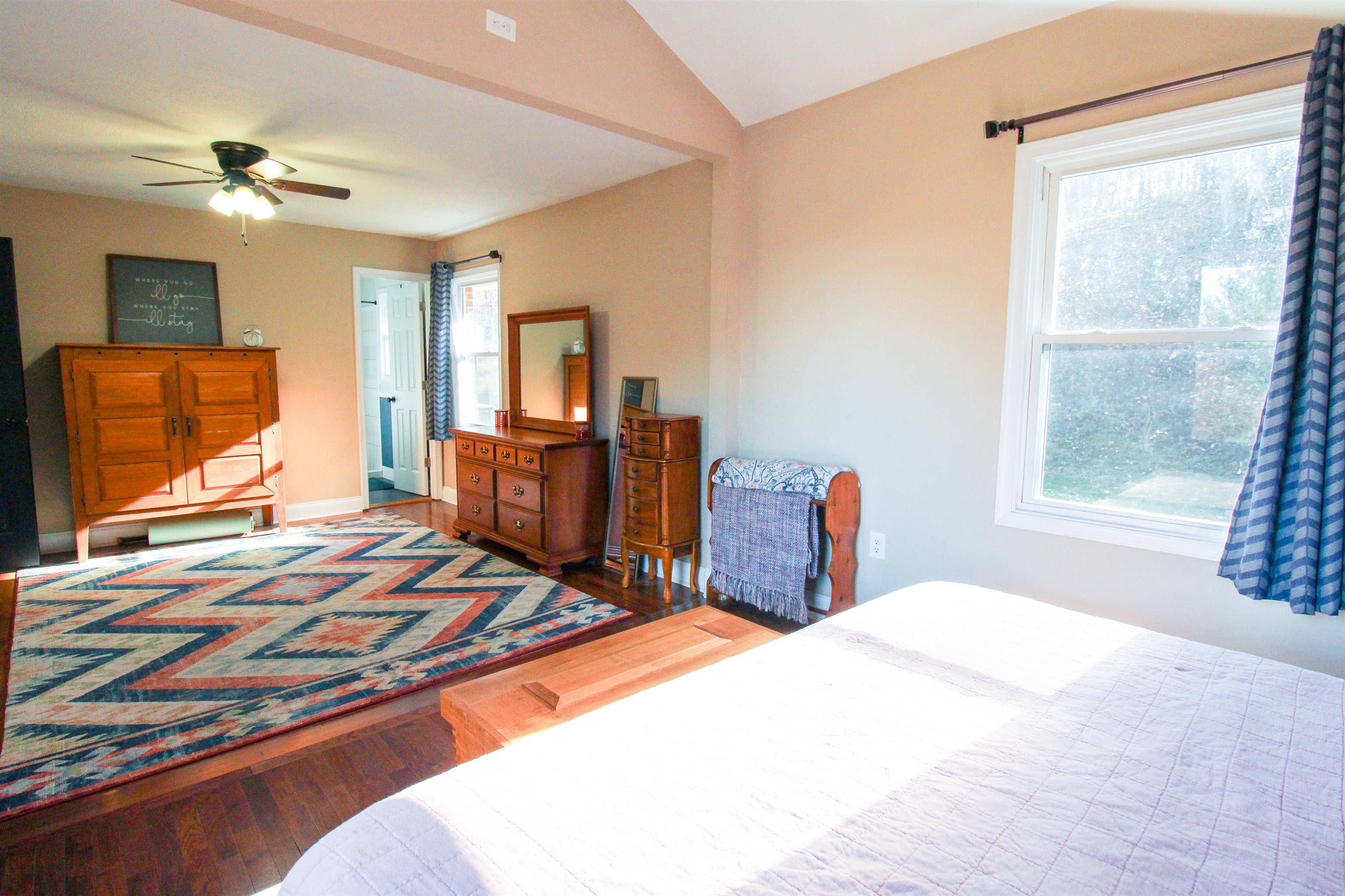 169 Calf Mountain Road Waynesboro, VA 22980 - Photo 43 of 74 a bedroom with a bed and wooden floor