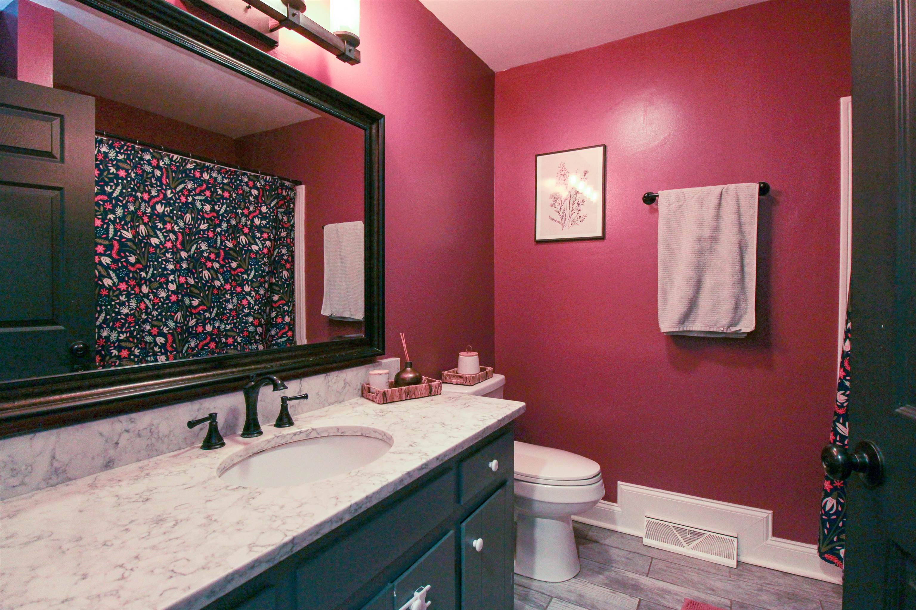 169 Calf Mountain Road Waynesboro, VA 22980 - Photo 55 of 74 a bathroom with a granite countertop sink a toilet and a mirror