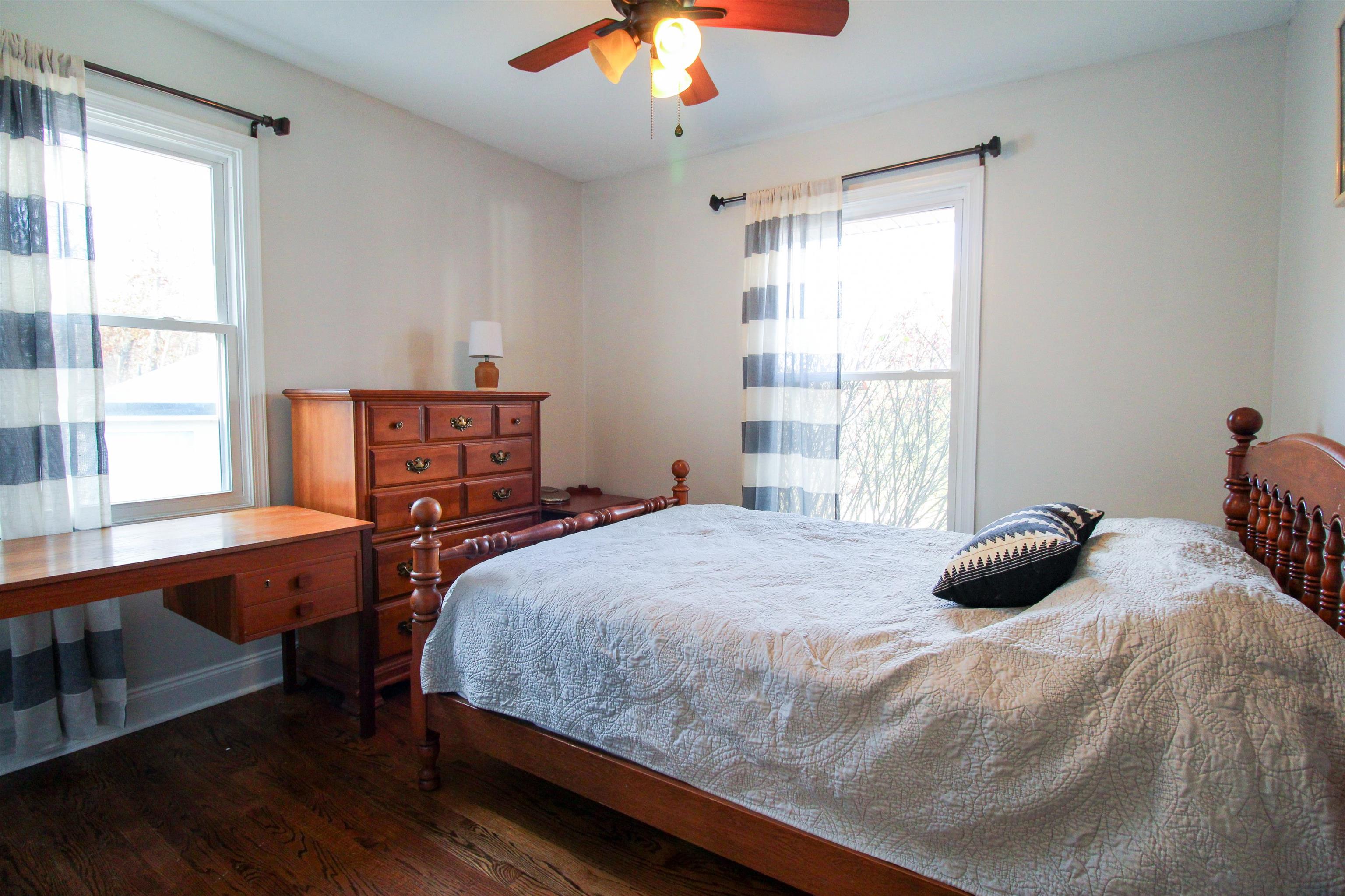 169 Calf Mountain Road Waynesboro, VA 22980 - Photo 56 of 74 a bedroom with a bed a window and table