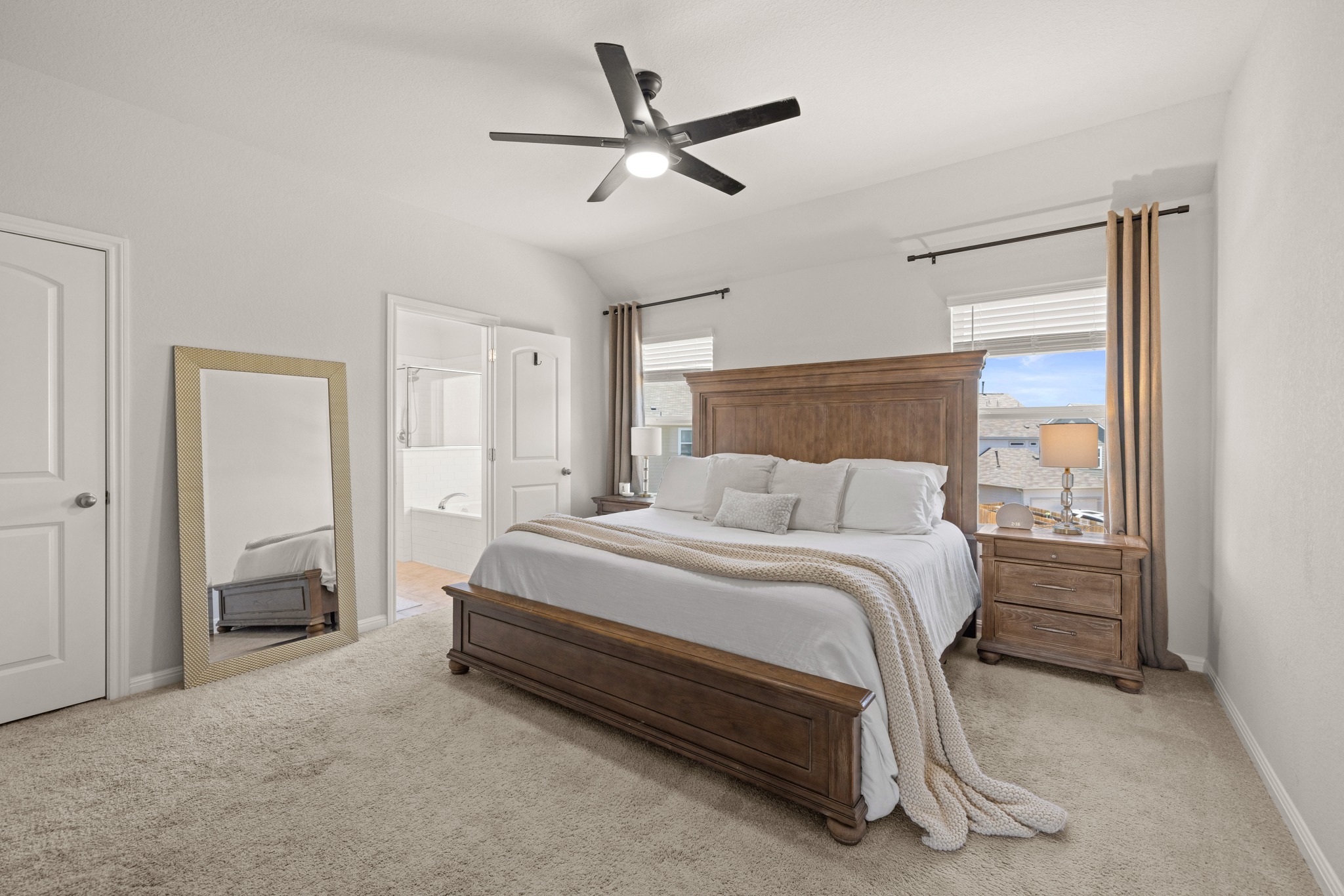 2049 Winston Way Leander, TX 78641 - Photo 13 of 35 Large primary bedroom is located upstairs with vaulted ceiling, ceiling fan and walk-in closet.