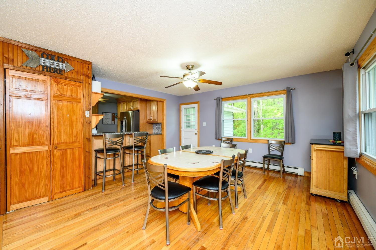 439 Cassville Road Jackson, NJ 08527 - Photo 12 of 45 a view of a dining room with furniture and wooden floor