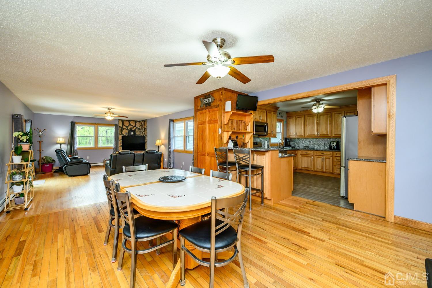 439 Cassville Road Jackson, NJ 08527 - Photo 13 of 45 a view of a dining room with furniture and a chandelier