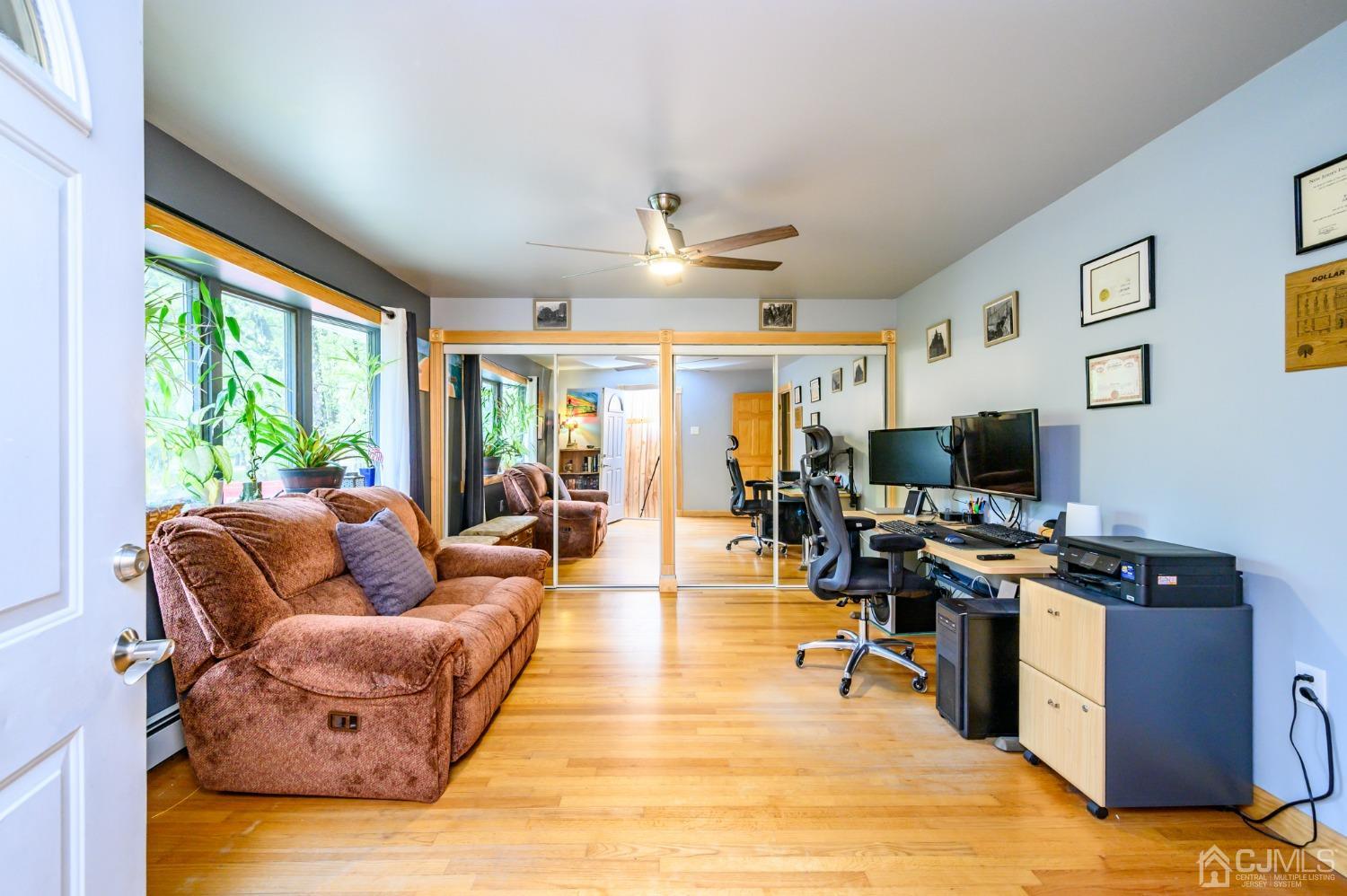 439 Cassville Road Jackson, NJ 08527 - Photo 2 of 45 a living room with furniture kitchen view and a large window