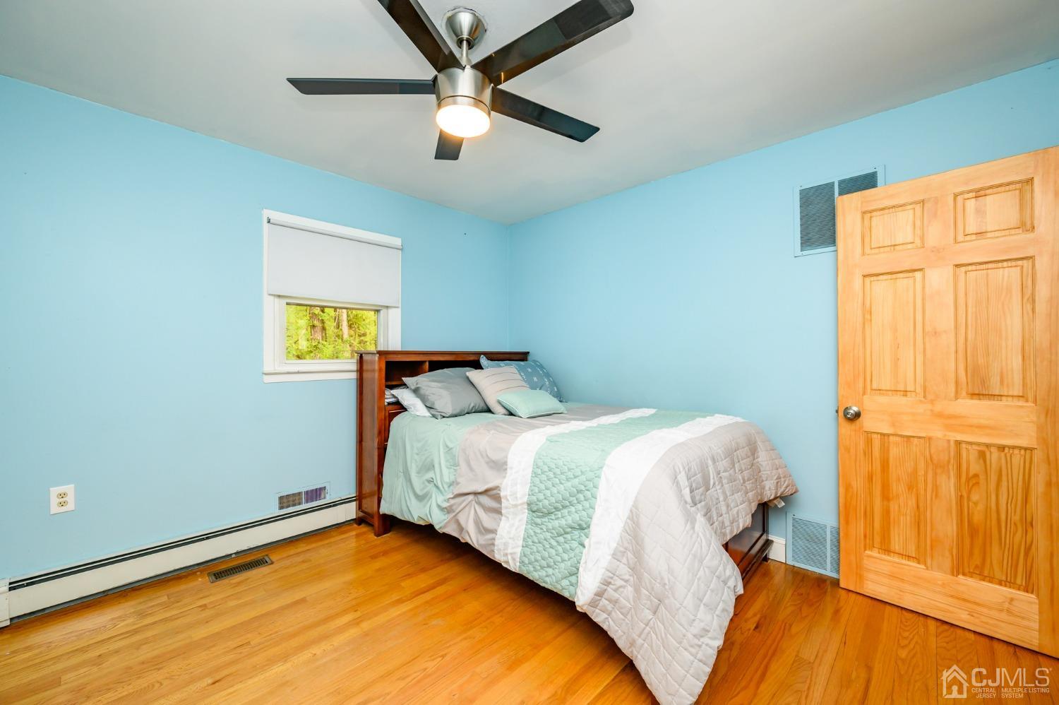 439 Cassville Road Jackson, NJ 08527 - Photo 23 of 45 a bedroom with a bed and a window