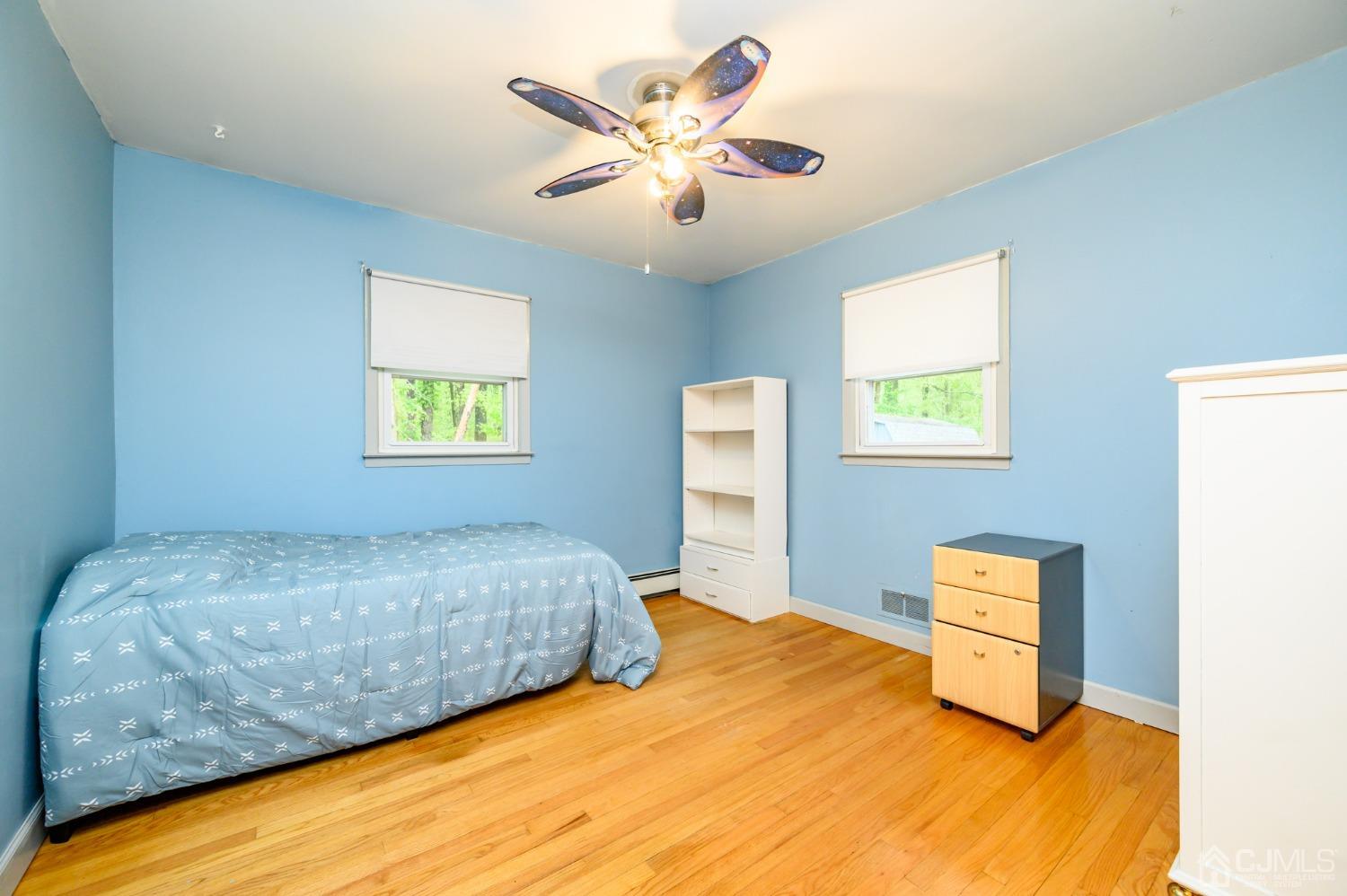 439 Cassville Road Jackson, NJ 08527 - Photo 25 of 45 a bedroom with a bed and a window