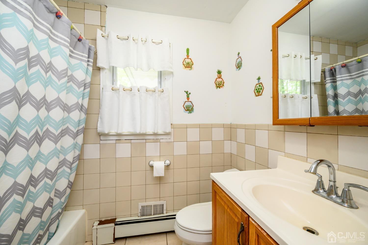 439 Cassville Road Jackson, NJ 08527 - Photo 27 of 45 a bathroom with a sink a toilet and shower