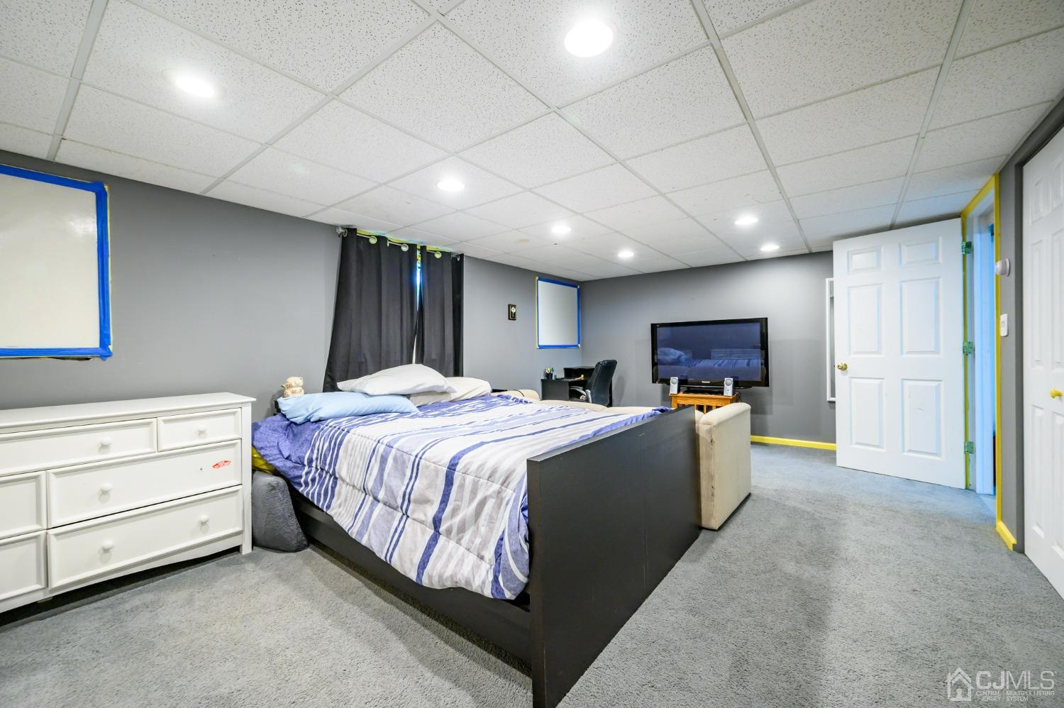 439 Cassville Road Jackson, NJ 08527 - Photo 28 of 45 a bed room with a bed and a television