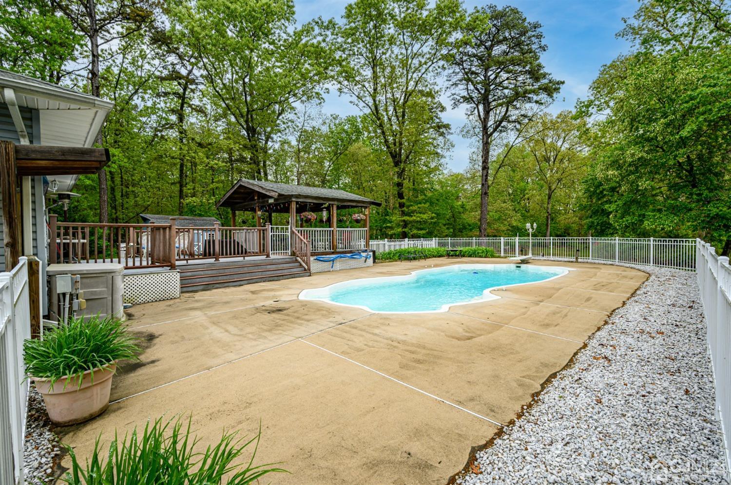 439 Cassville Road Jackson, NJ 08527 - Photo 32 of 45 a view of a swimming pool with a patio