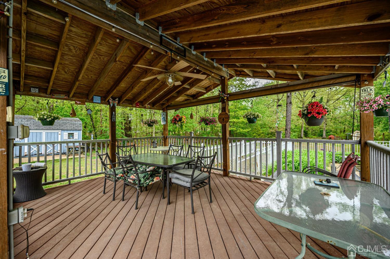 439 Cassville Road Jackson, NJ 08527 - Photo 37 of 45 a view of a chairs and table in patio with wooden floor