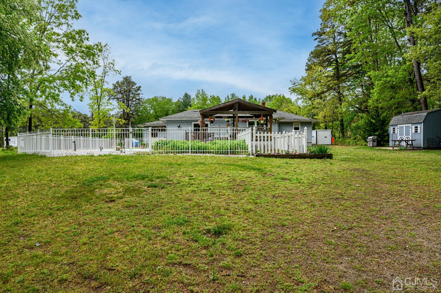 439 Cassville Road Jackson, NJ 08527 - Photo 45 of 45 a house view with swimming pool in front of it