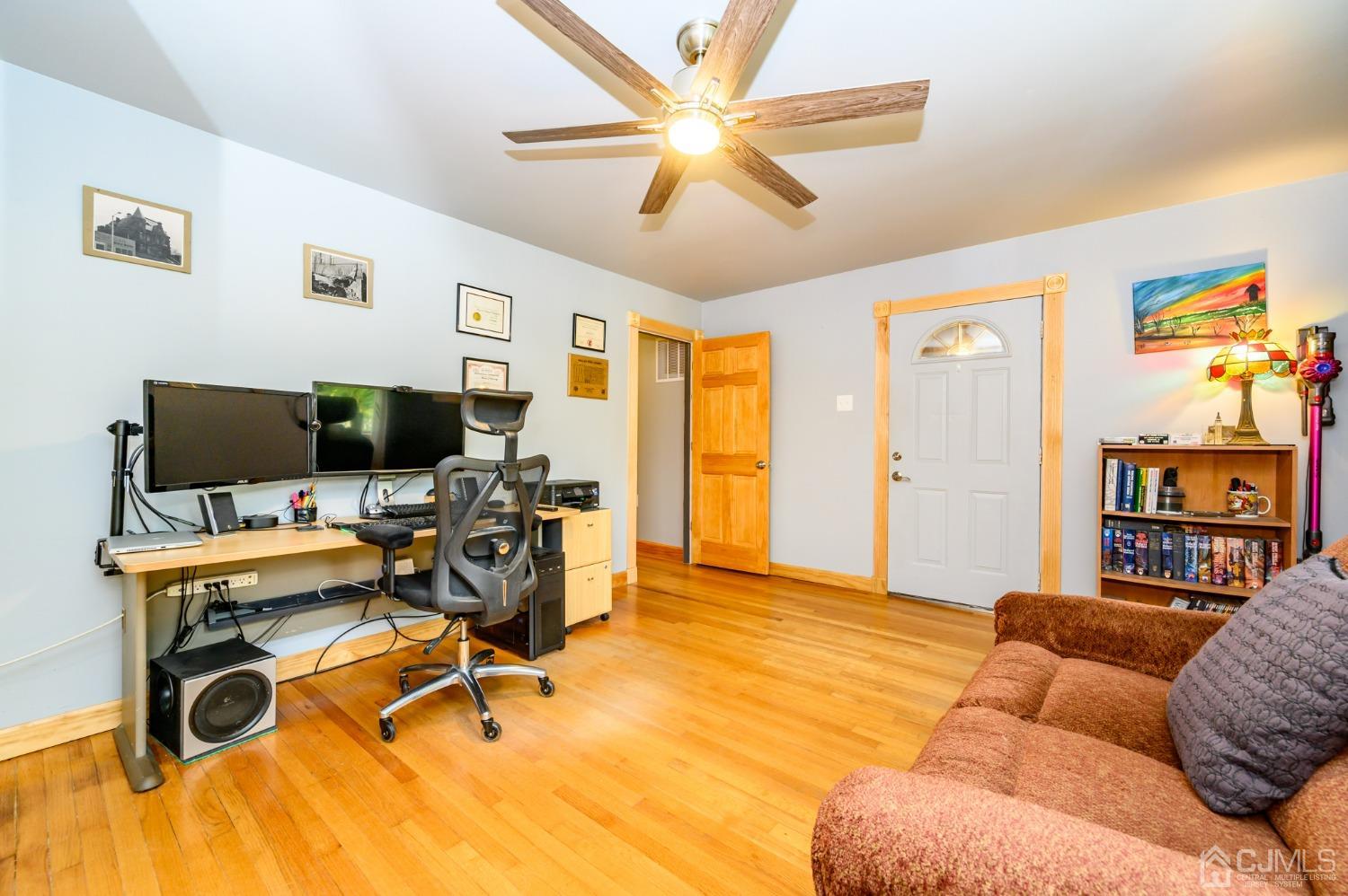 439 Cassville Road Jackson, NJ 08527 - Photo 5 of 45 a view of a livingroom with workspace and a couch