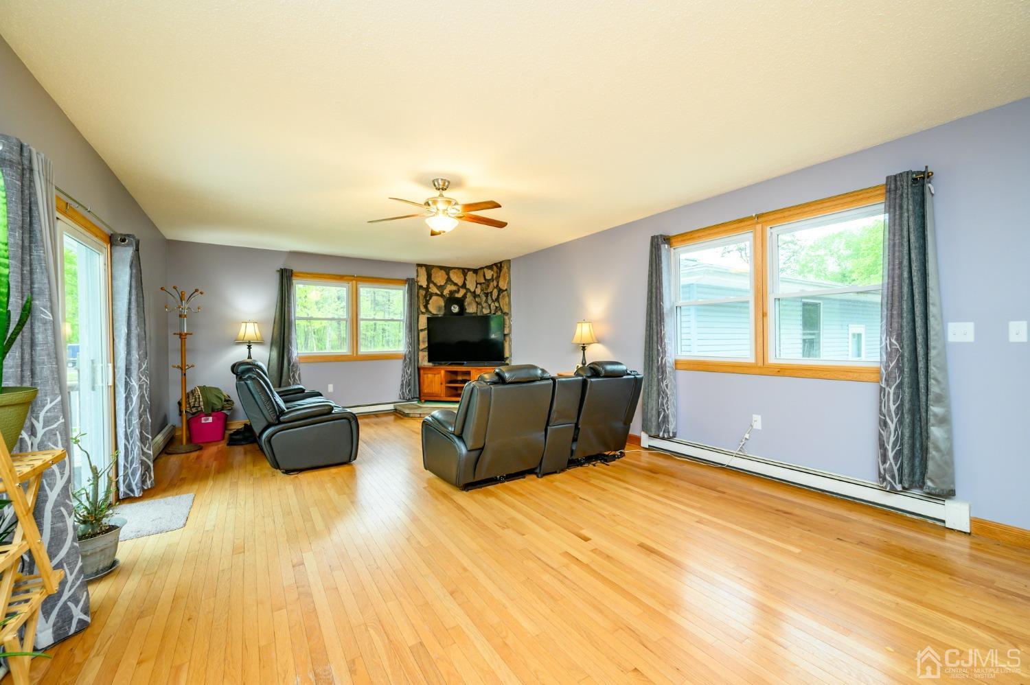 439 Cassville Road Jackson, NJ 08527 - Photo 6 of 45 a living room with furniture and a flat screen tv