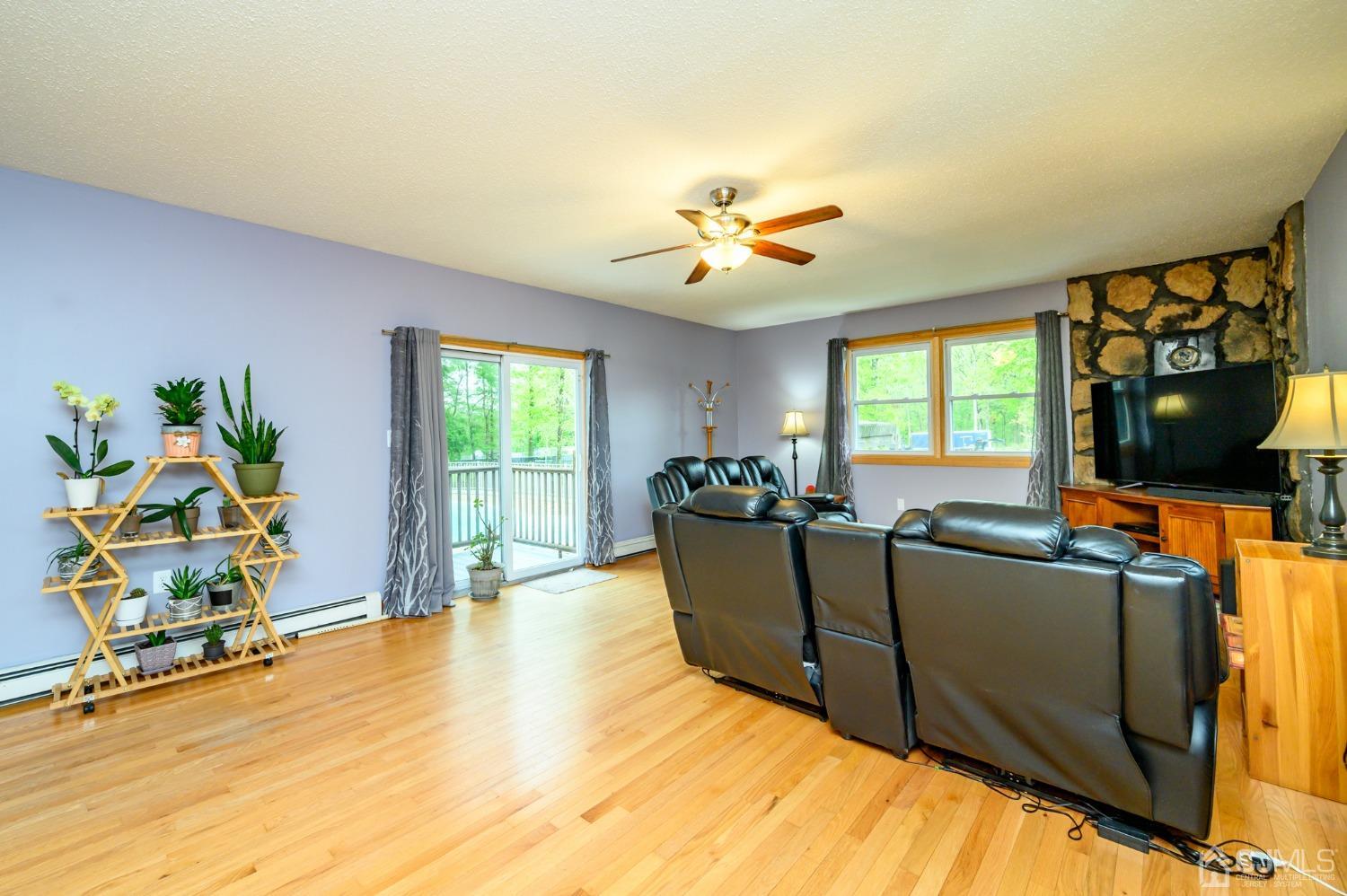 439 Cassville Road Jackson, NJ 08527 - Photo 8 of 45 a living room with furniture and a flat screen tv