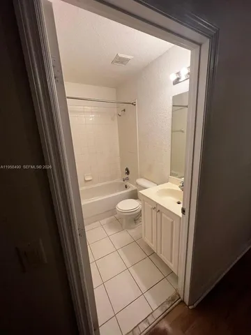 a bathroom with a shower and a toilet
