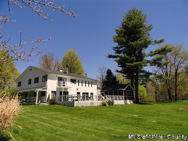 895 Buck Road Stone Ridge, NY 12484 - Photo 21 of 22 a view of a house with a big yard and a large trees