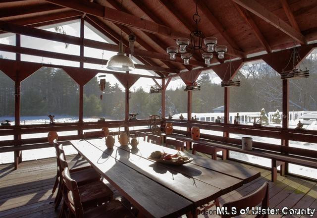895 Buck Road Stone Ridge, NY 12484 - Photo 6 of 22 a view of a chairs and table in the patio