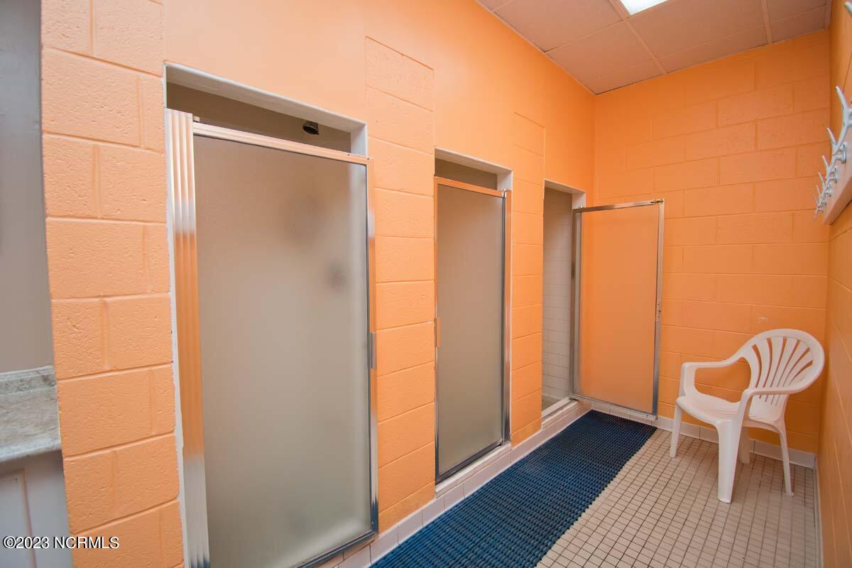 1505 Salter Path Road, Unit 404 Indian Beach, NC 28512 - Photo 33 of 48 locker room showers