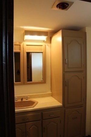30 Birchmeadow Road Amesbury, MA 01913 - Photo 13 of 26 a bathroom with a sink and a mirror