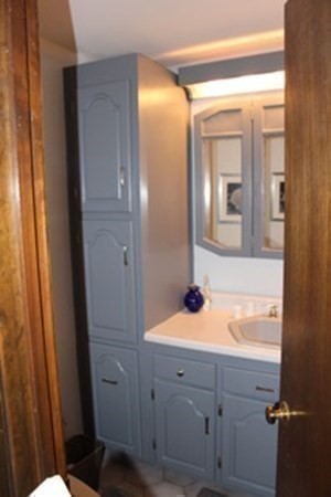 30 Birchmeadow Road Amesbury, MA 01913 - Photo 16 of 26 a bathroom with a sink and mirror with toilet